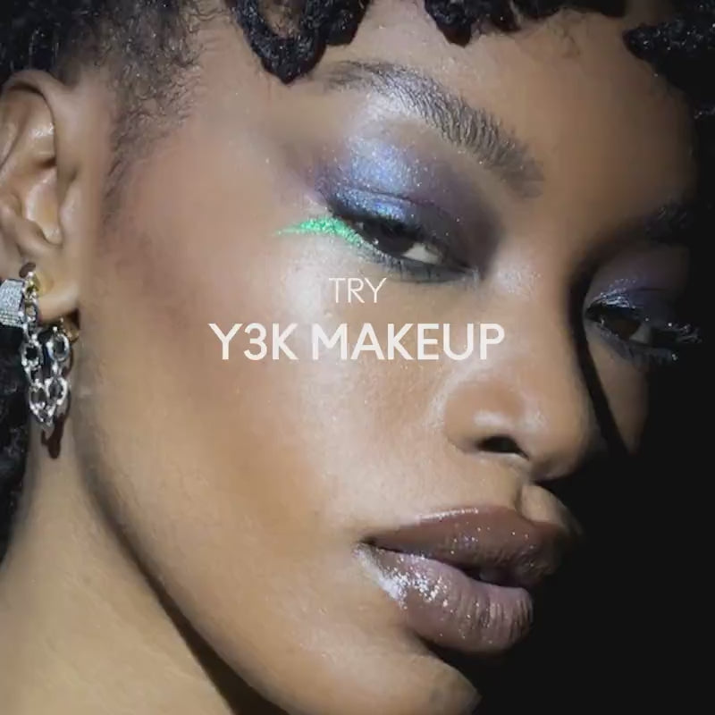 Load video: A teal chrome gaze and glossy mirrored lips give this Y3K look back-to-the-future energy.
