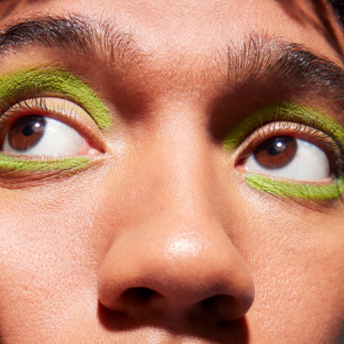 Model with MAC Cosmetics product.