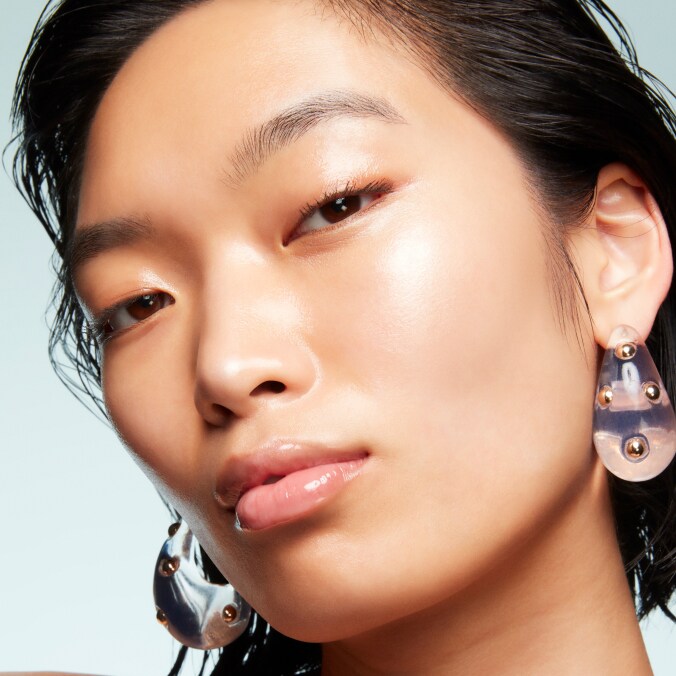 Model with MAC Cosmetics product.